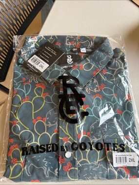 Raised By Coyotes Men's Button-Down Shirt in Teal with Stitch Print